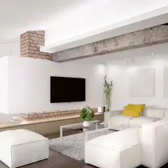 Nowoczesny salon z białym narożnikiem, ceglanym podciągiem i telewizorem.